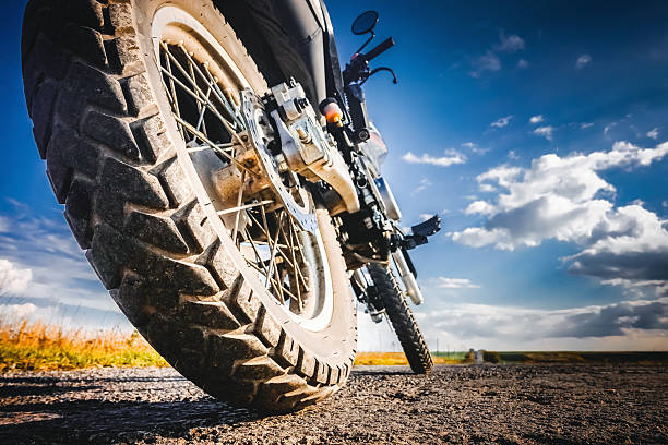 istock Studded cross motorcycle wheel on the ground level. 2207836357