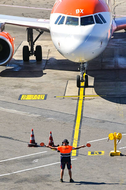 Jet plane taxiing on the runway with wheels turning, preparing for takeoff