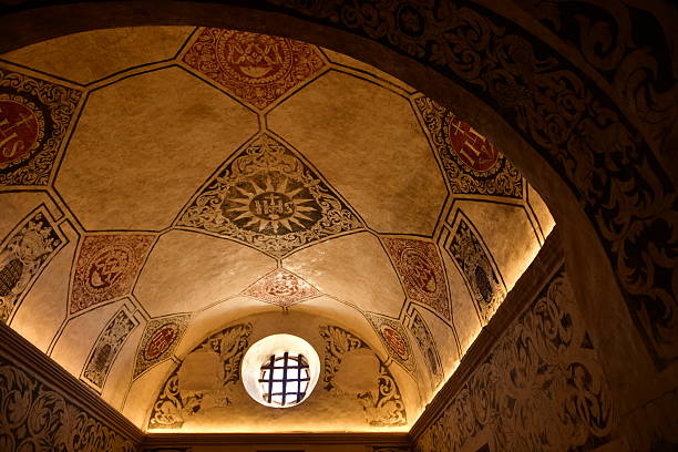 Sant Miquel De Balansat church on a hill overlooking Sant Miguel harbour, interior vaulted decorated ceiling.