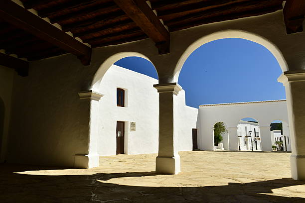 Sant Miquel De Balansat church on a hill overlooking Sant Miguel harbour and coast.