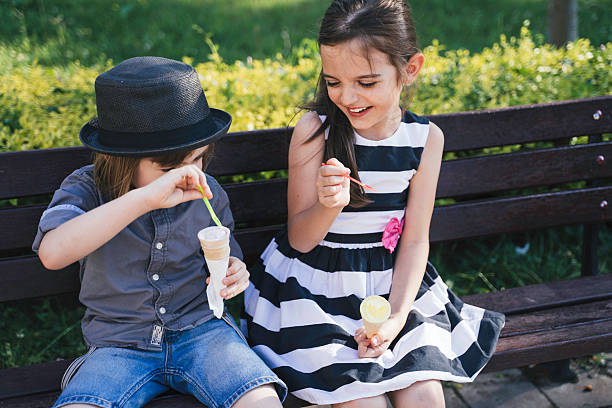 istock Happy Kids with Ice Cream Cones in Park 2207843844