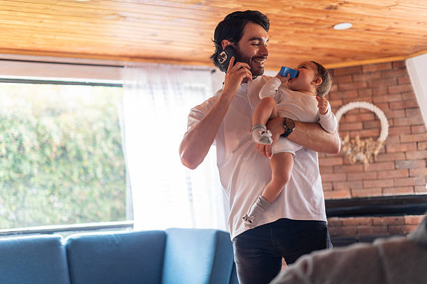 istock Father holding his baby 2207844652
