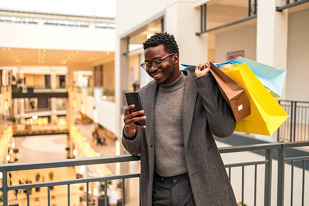 istock Business man in a shopping center 2207846020