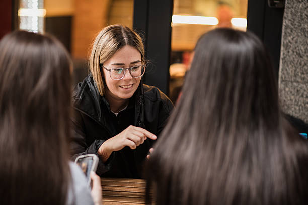 istock Three young girl friends making plans for the day 2207846737