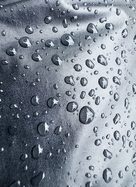 istock Close-up of Water Droplets on Waterproof Fabric Texture 2207850127