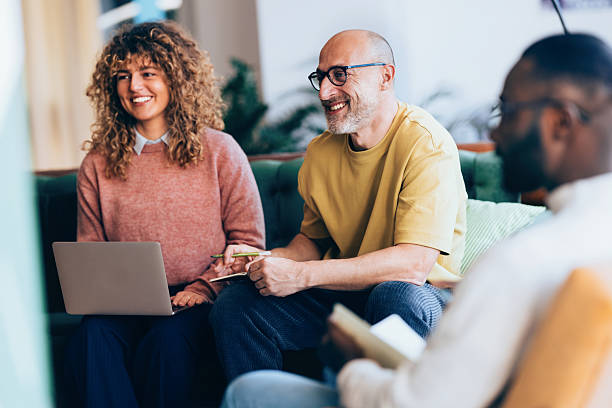 Colleagues Collaborating Together in a Bright and Casual Office Setting