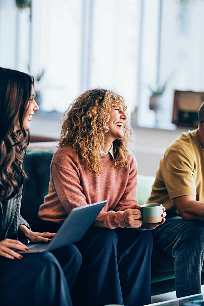 istock Group of Friends Having a Positive Conversation in a Bright Room 2207850486