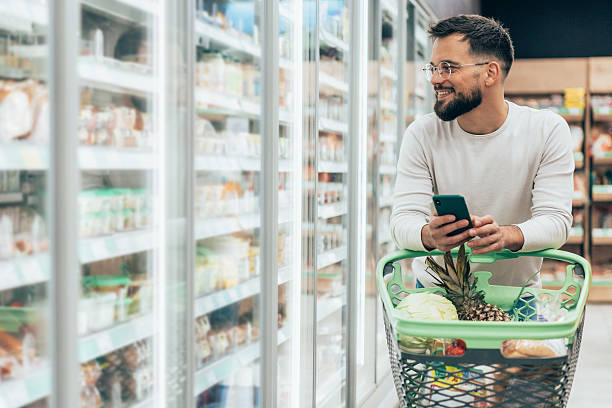 istock Handsome man shopping in supermarket 2207851977