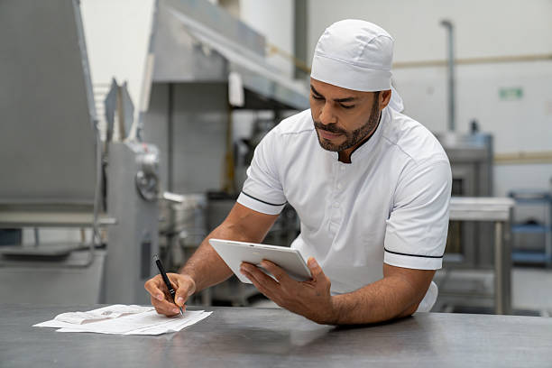 istock Business manager at an industrial bakery doing the accountancy using a tablet 2207852391