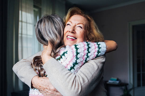 istock Joyful Embrace Between Two Generations in a Cozy Indoor Setting 2207852670