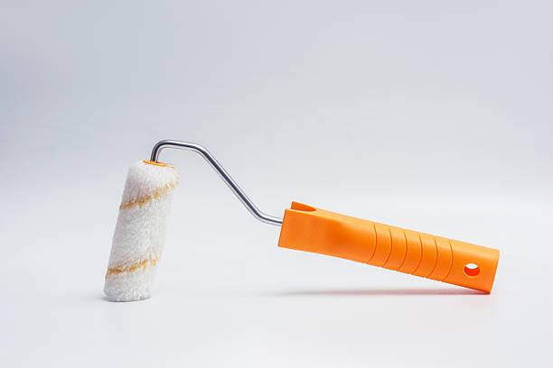 istock An orange paint roller on a clean white background. Concept home renovation and DIY painting projects. 2207852982
