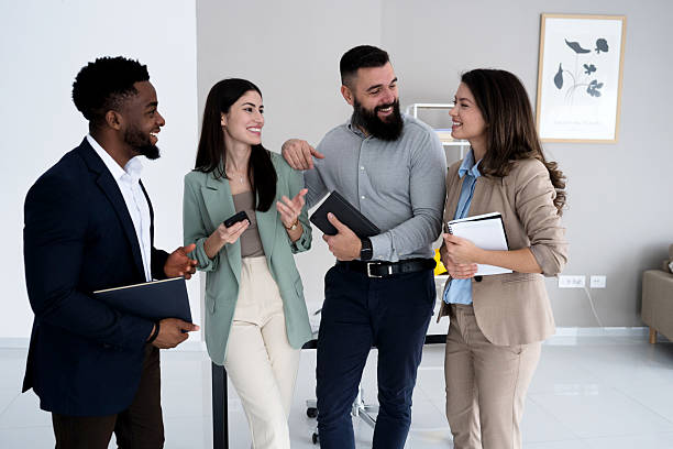 istock Group of business people standing and talking 2207853318