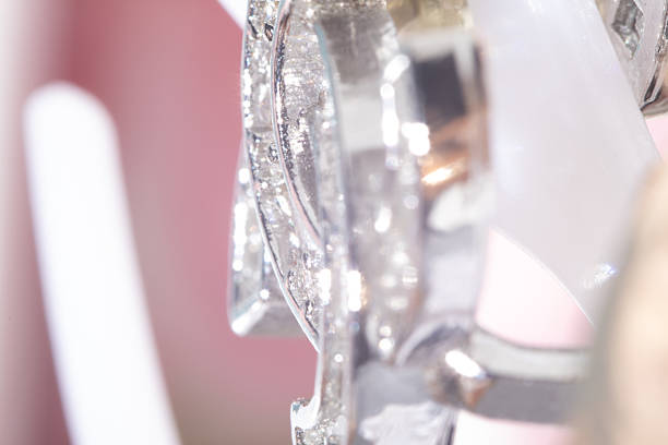 Luxury metal background. Bright and luminous macro shot capturing the reflective beauty of silver decor. Aesthetic blurred background with soft focus in high key