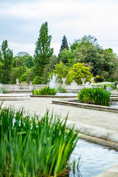 istock Elegant Outdoor Fountain Surrounded by Greenery and Balustrade Architecture 2207857717