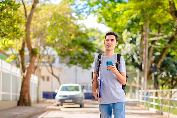 istock Brazilian University Student Using Smartphone Outdoors 2207859706