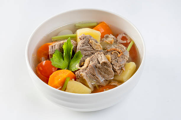 istock Beef stew with potatoes, tomatoes, carrots, onions and vegetables. 2207861105