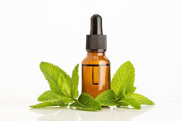 istock Peppermint essential oil on white background 2207861173