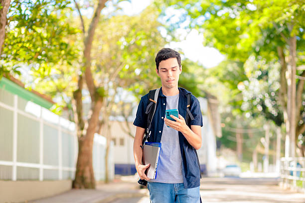 istock Brazilian University Student Using Smartphone Outdoors 2207861644