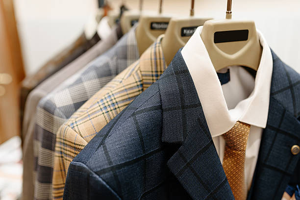 istock men jackets hang on hangers in showroom 2207863675