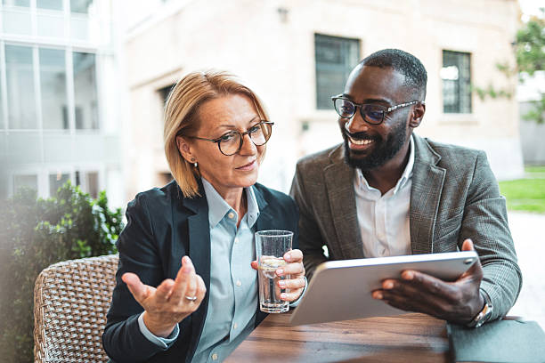 istock Business colleagues discussing strategy while looking at a tablet 2207865066