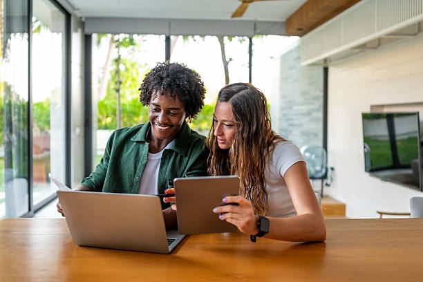 istock Young Professionals Collaborating on Digital Devices in Modern Office 2207865218