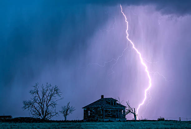 istock Lightening from supercell with abandoned farmhouse 2207870973
