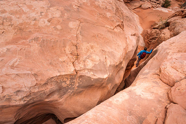 istock Tight Squeeze Hiking in Slot Canyon 2207874139