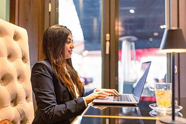 istock Freelancer Working on Laptop in Cozy Cafe 2207874271