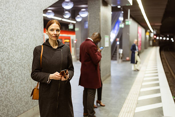 istock City Commuters Waiting on Subway Platform at Dusk 2207874289