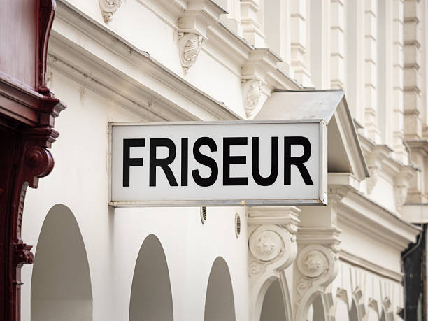 istock Friseur (Hairdresser) Sign on a Building Exterior 2207875155