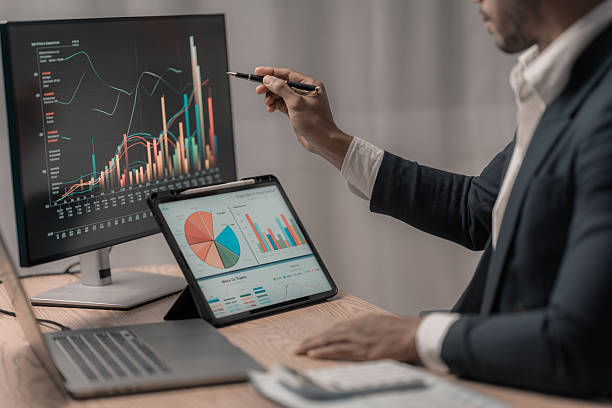 istock Stock market analyst, data exchange, digital chart on computer screen, thinking about investing, risk analysis, finance 2207876970