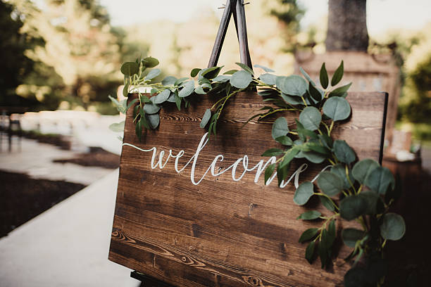 istock Wood welcome sign with greenery set up at wedding ceremony 2207877206