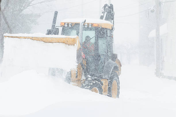 istock Snow removal tractor during a heavy blizzard. 2207877704