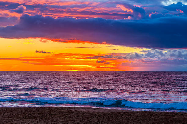 Sunrise Seascape with rain clouds at Bilgola Beach on the Northern Beaches of Sydney, NSW, Australia.