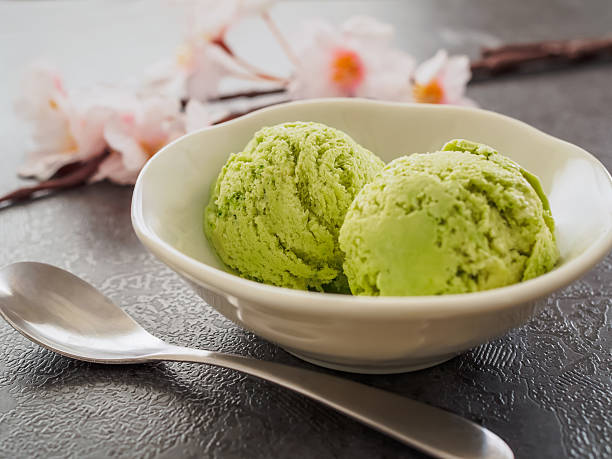 istock Green tea ice cream with cherryblossom 2207880304