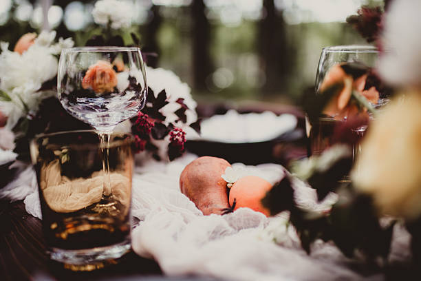 An elegantly arranged dining table with exquisite tableware, fresh fruits, and floral decor for any gathering