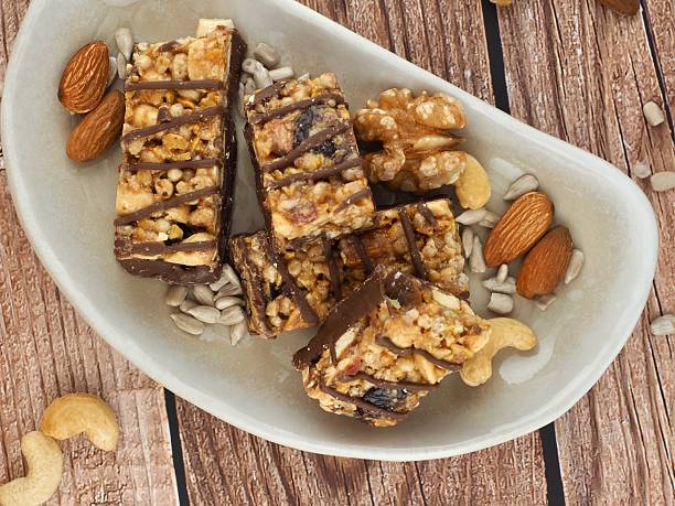 istock Chocolate bar and nuts, Almonds, walnuts, raspberries, Cashew nut, Sunflower seeds 2207883275
