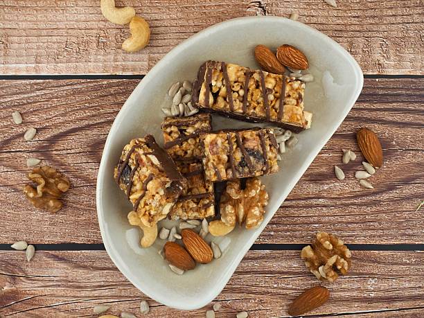 istock Chocolate bar and nuts, Almonds, walnuts, raspberries, Cashew nut, Sunflower seeds 2207883277