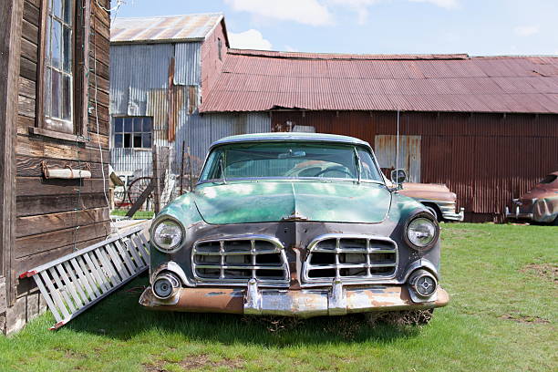 istock Abandoned Vintage Car by a Barn 2207886126