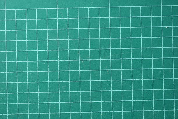 istock green cutting mat board background with line and scale measure guide pattern for object art design, tool equipment of diy craft work 2207887564