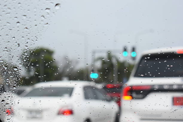istock car on highway road with rainny season, blurred image 2207887606