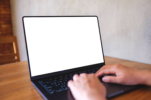 istock Mockup image of a woman using and typing on computer laptop with blank desktop screen 2207892269