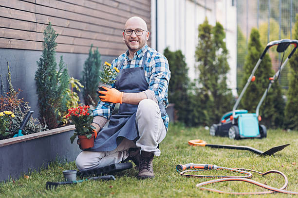 istock Happy middle age man working in the garden 2207895132