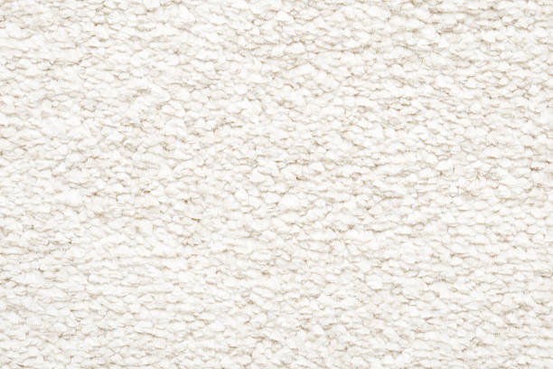 istock White new fluffy home carpet background. Closeup. Empty place for text. Top down view. 2207897656