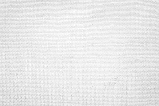 istock White color fabric canvas woven texture background in pattern light blank. Natural gauze linen, carpet wool and cotton cloth textile textured as clean empty for decoration text. Grey sack material. 2207900653