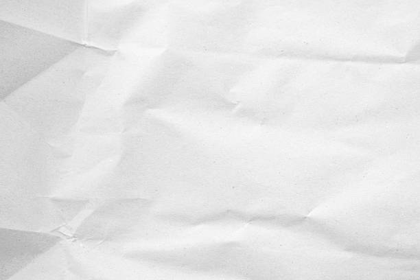 istock White recycled craft paper texture as background. Grey paper texture, Old vintage page or grunge vignette of old newspaper. Pattern rough art creased grunge letter. Hardboard with copy space for text. 2207900656