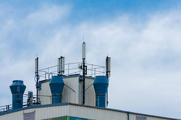 istock Communication antennas and ventilation  on rooftop of building 2207909963