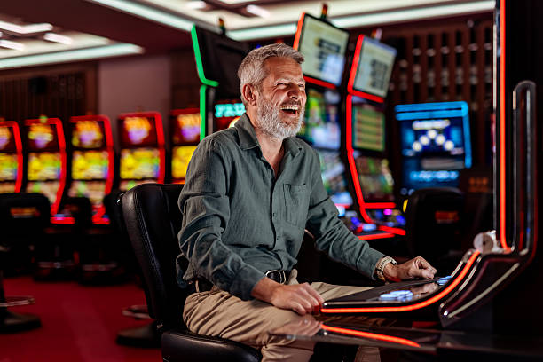 Line of electronic slot machines in casino. Property released.