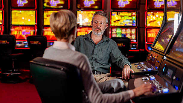 istock Two Individuals Interacting in a Modern Casino Environment 2207912007
