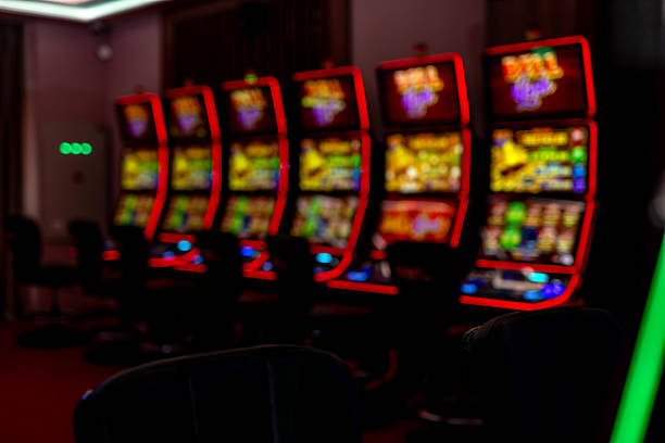 istock Brightly Illuminated Slot Machines in a Modern Casino Interior 2207912028